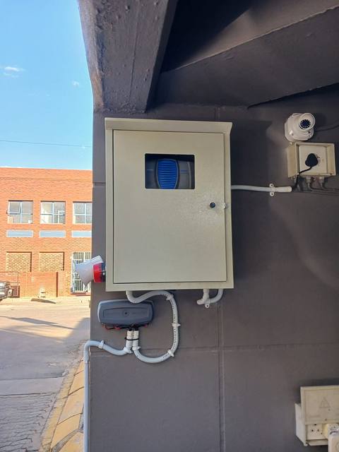 Alarm siren in a protective enclosure installed by JNT